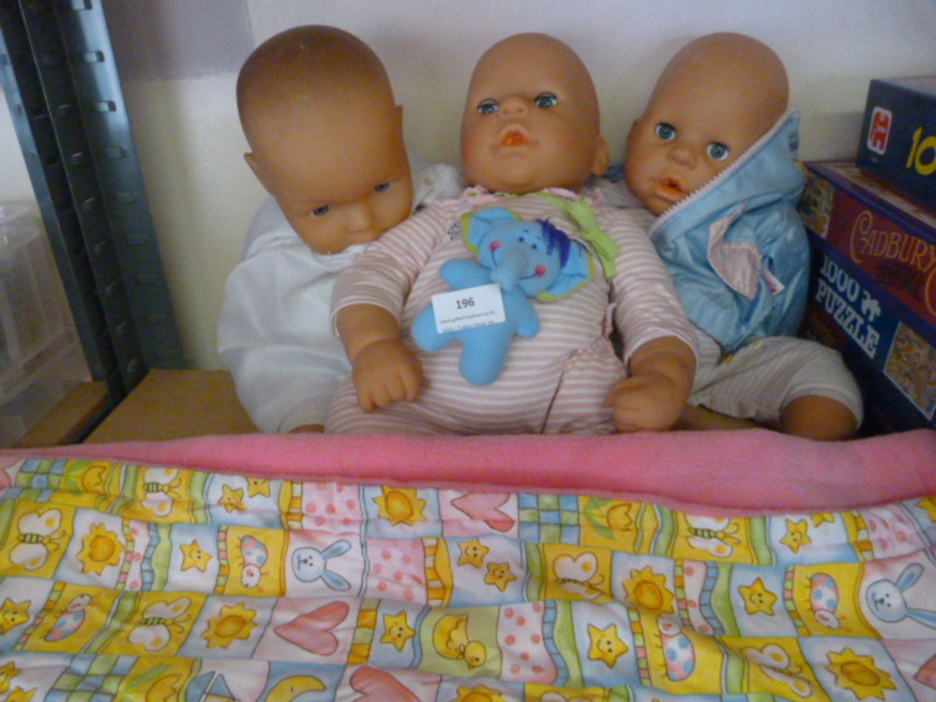 Three Dolls and a Baby Blanket