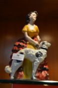 Figure of a Spanish Lady with a Hunting Dog