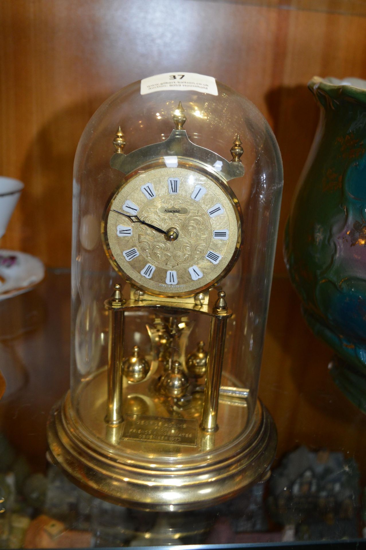 Brass Skeleton Clock in a Dome