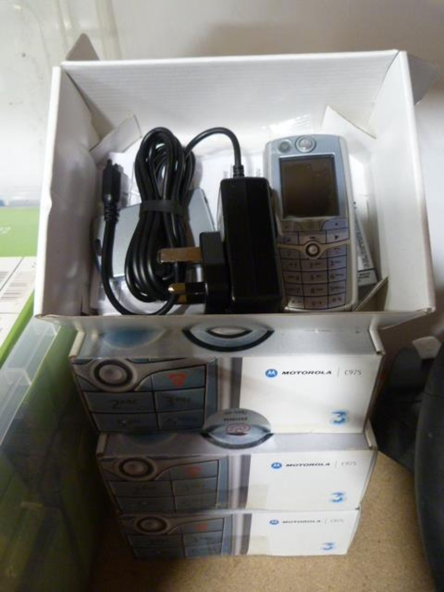 Four Motorola C975 Mobile Phones