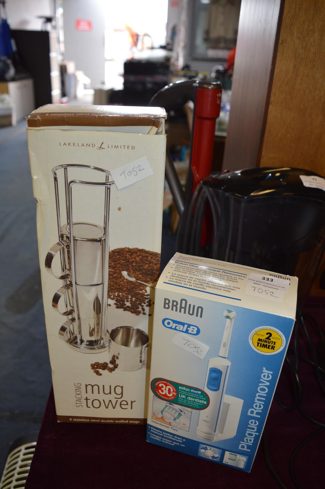 Braun Oral B Electric Toothbrush and a Mug Tower