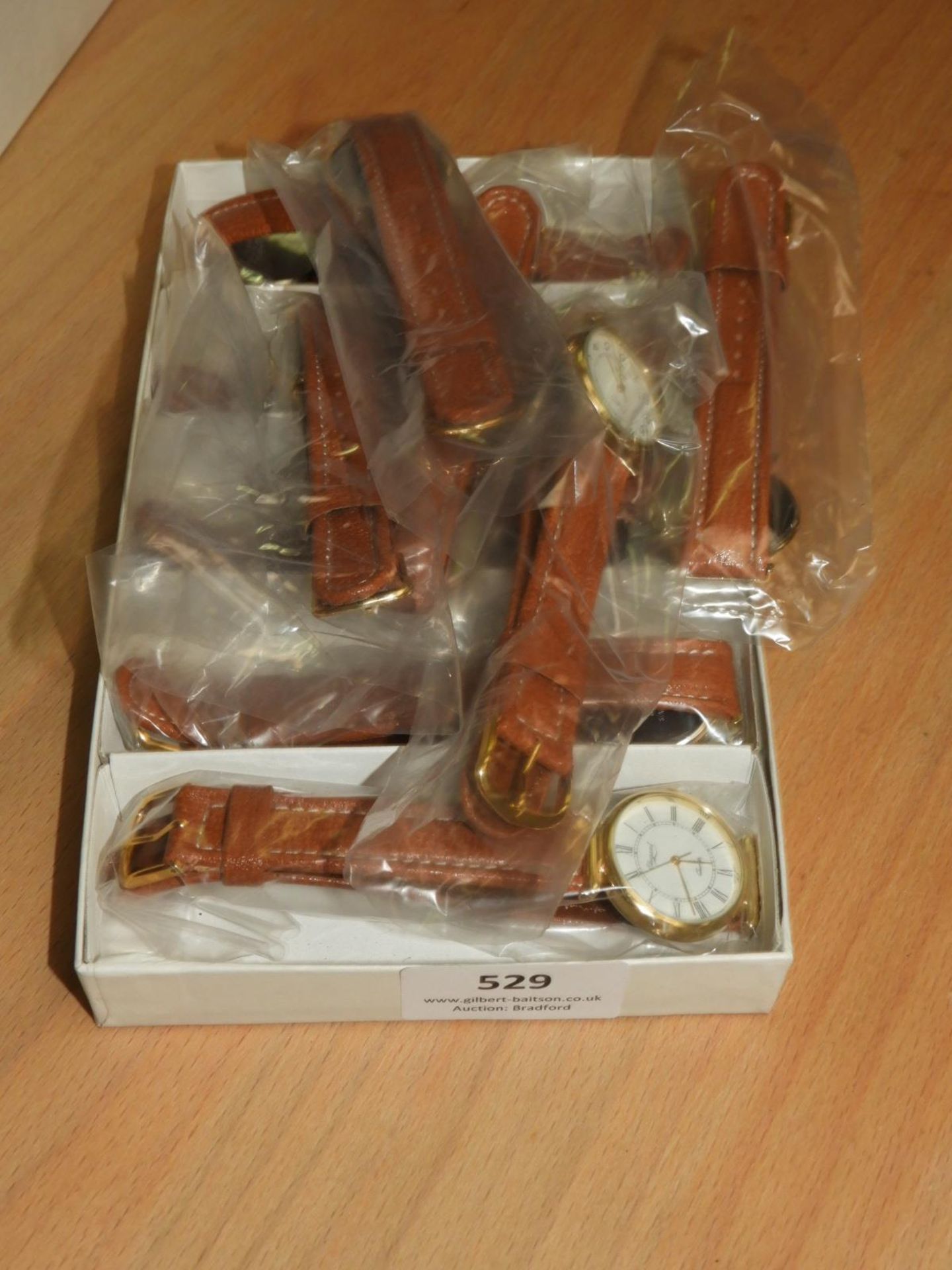 *Box Containing 10 Wristwatches with Roman Numeral