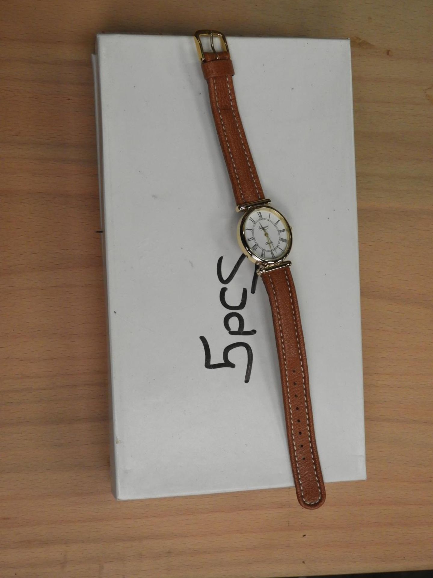 *Box Containing 10 Wristwatches with Roman Numeral