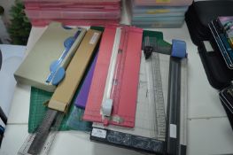 Assortment of Paper Trimmers, Cutting Mats, Rulers