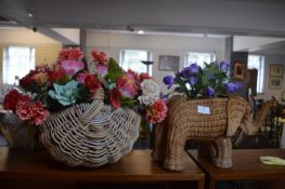 Two Baskets Containing Artificial Flowers