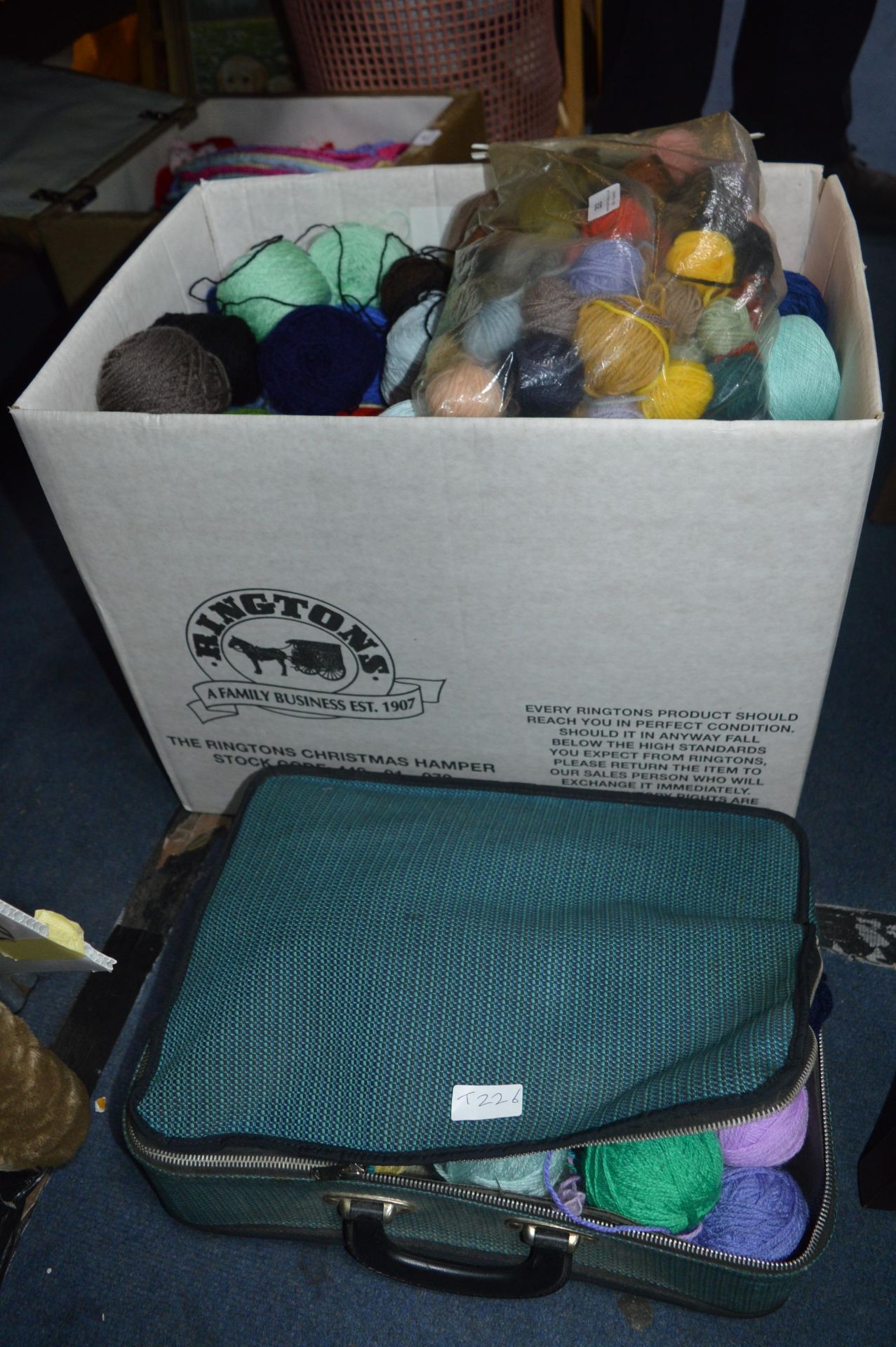 Large Box and a Case Containing Balls of Wool