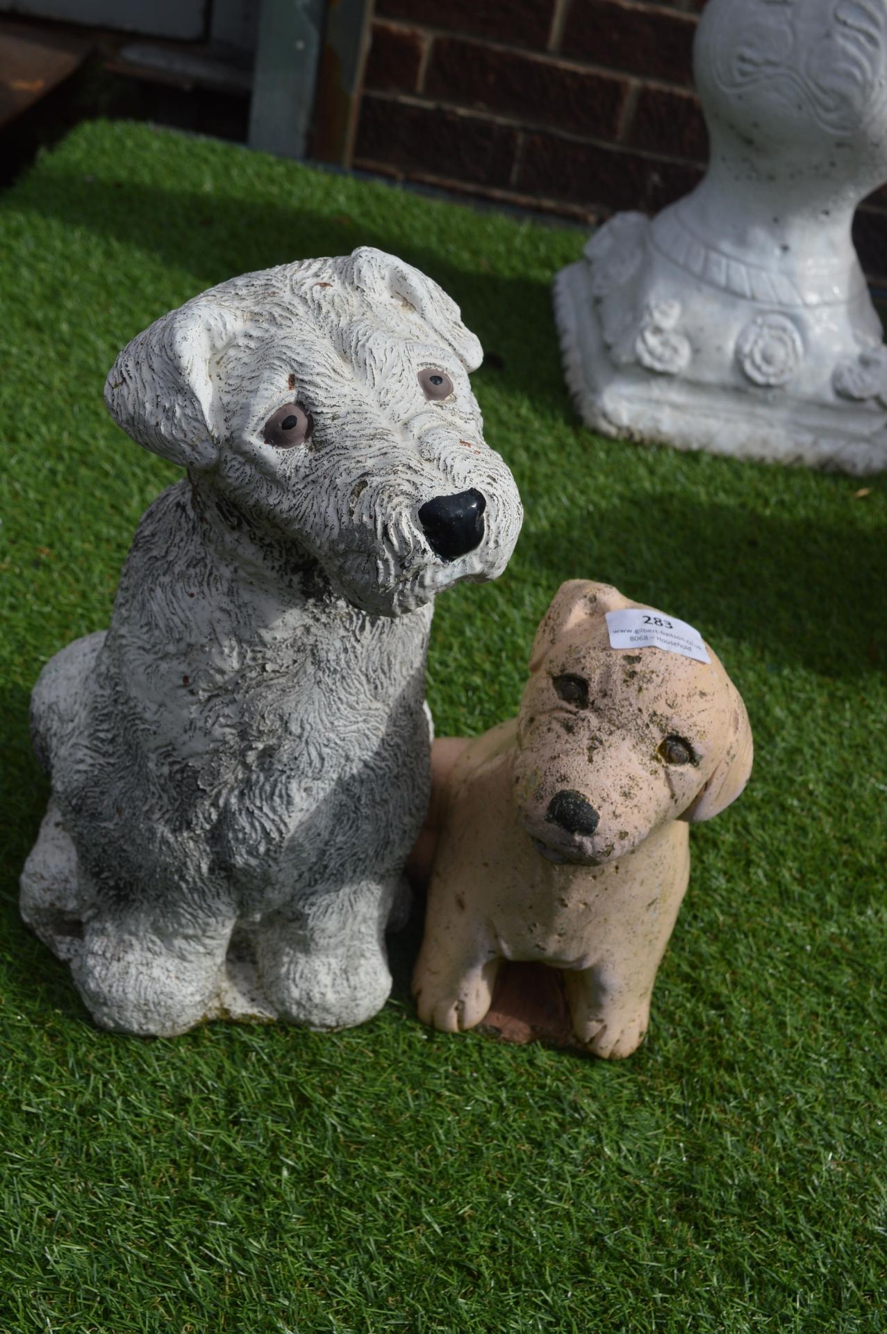 Two Painted Dog Garden Statues