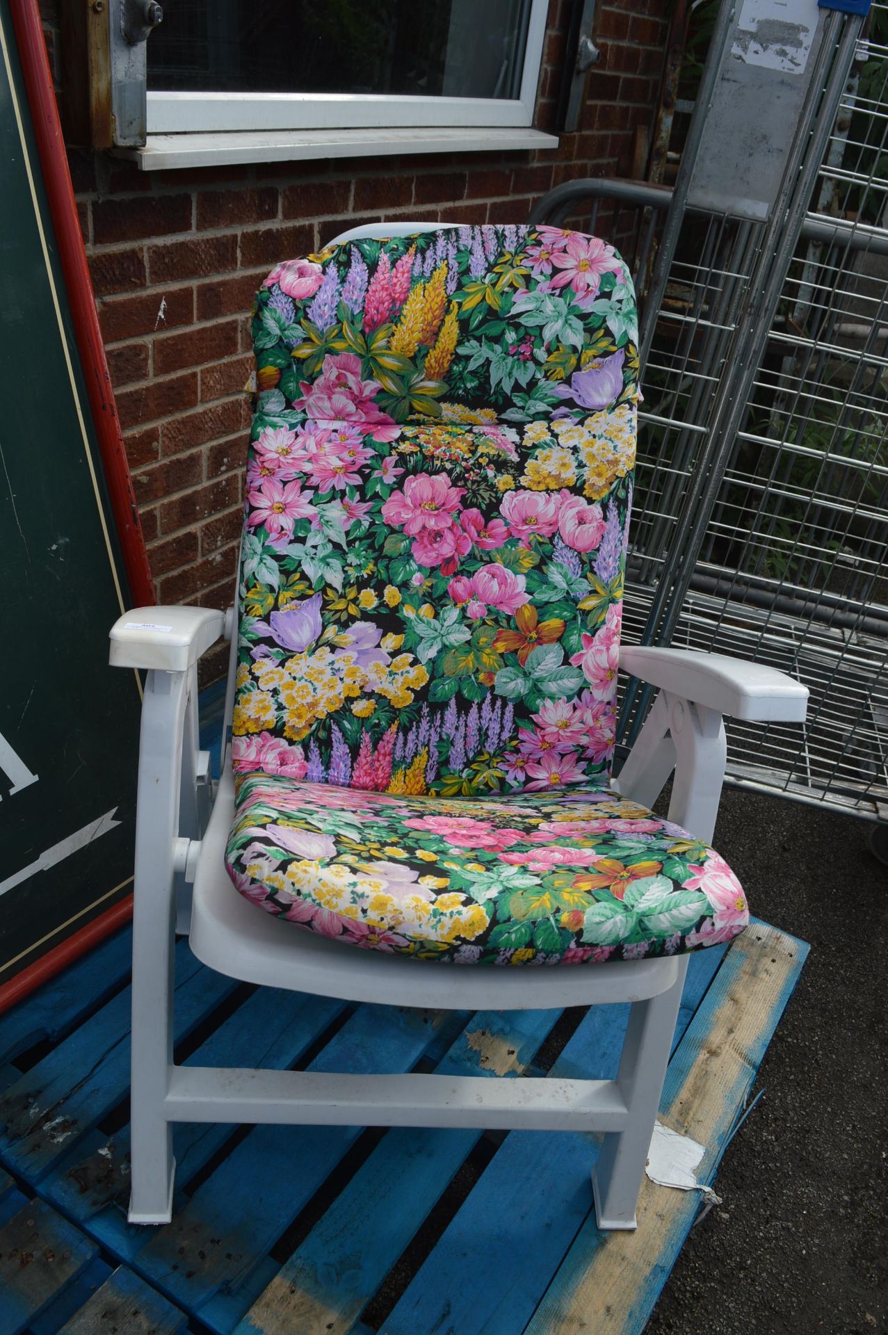 White Plastic Garden Chair with Floral Cushions