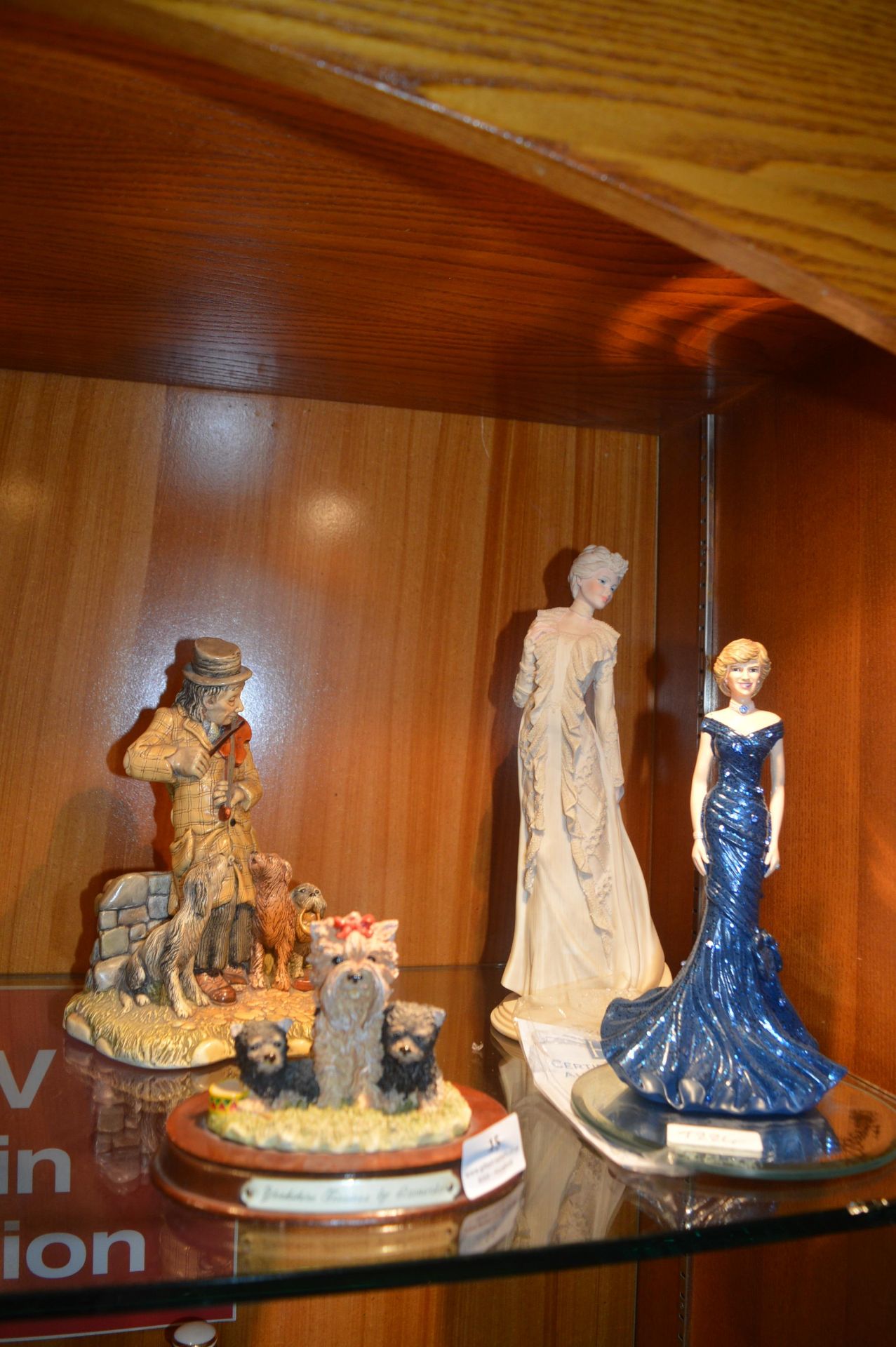 Four Figures Including Diana Princess of Wales