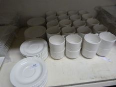 Forty White Stacking Tea Cups and Saucers