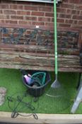 Lawn Rake and a Bucket of Accessories