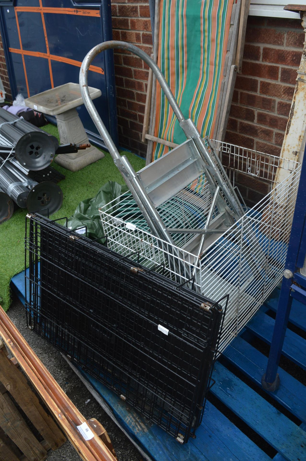 Black Dog Cage, One Other Cage and a Pair of Step