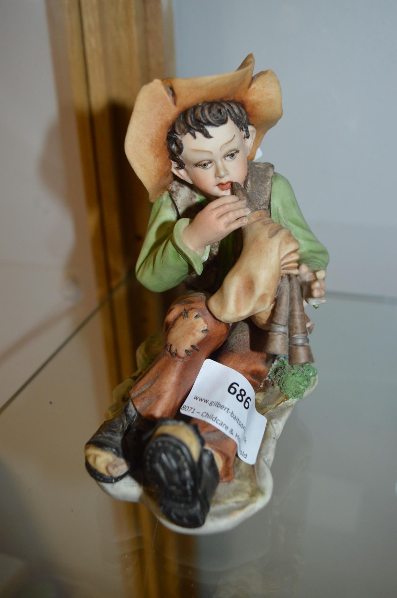 Figure of a Young Boy Playing the Pipes