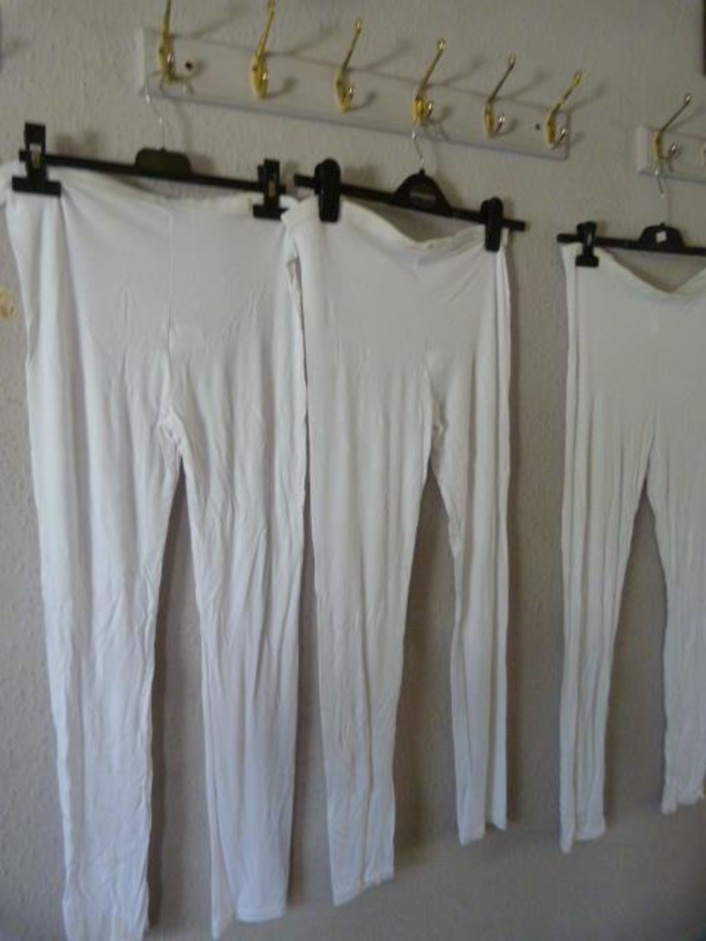 Three Pairs of White Leggings