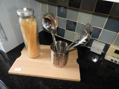 *Beech Chopping Board, Stainless Steel Kitchen Utensils and a Spaghetti Jar