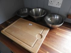 *Three Stainless Steel Bowls and a Chopping Board