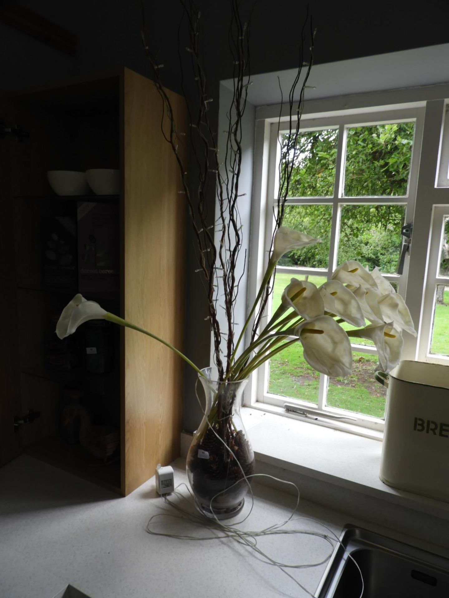 *Glass Vase Containing Artificial Lilies and LED Willow Twigs