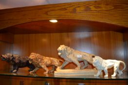 Four Modern Statues of Lions and a Bear