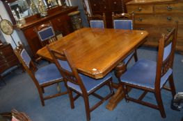 Oak Drawer Leaf Dining Table with Six Blue Upholstered Mahogany Chairs