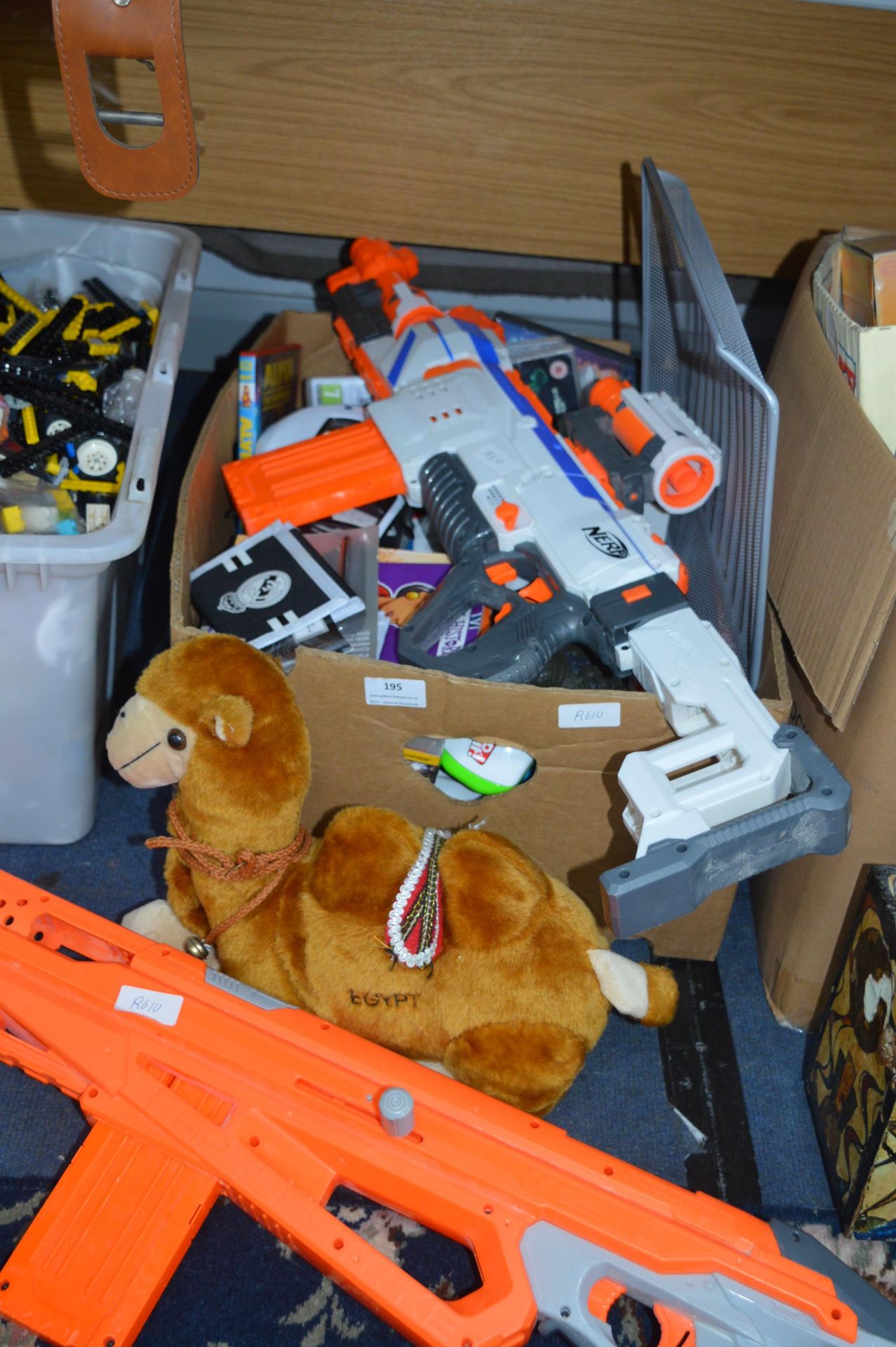 Box of Toys Including Nerf Gun and a Talking Camel