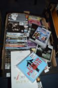 Box of CDs and DVDs