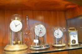 Three Skeleton Clocks under Glass Domes, Brass Car
