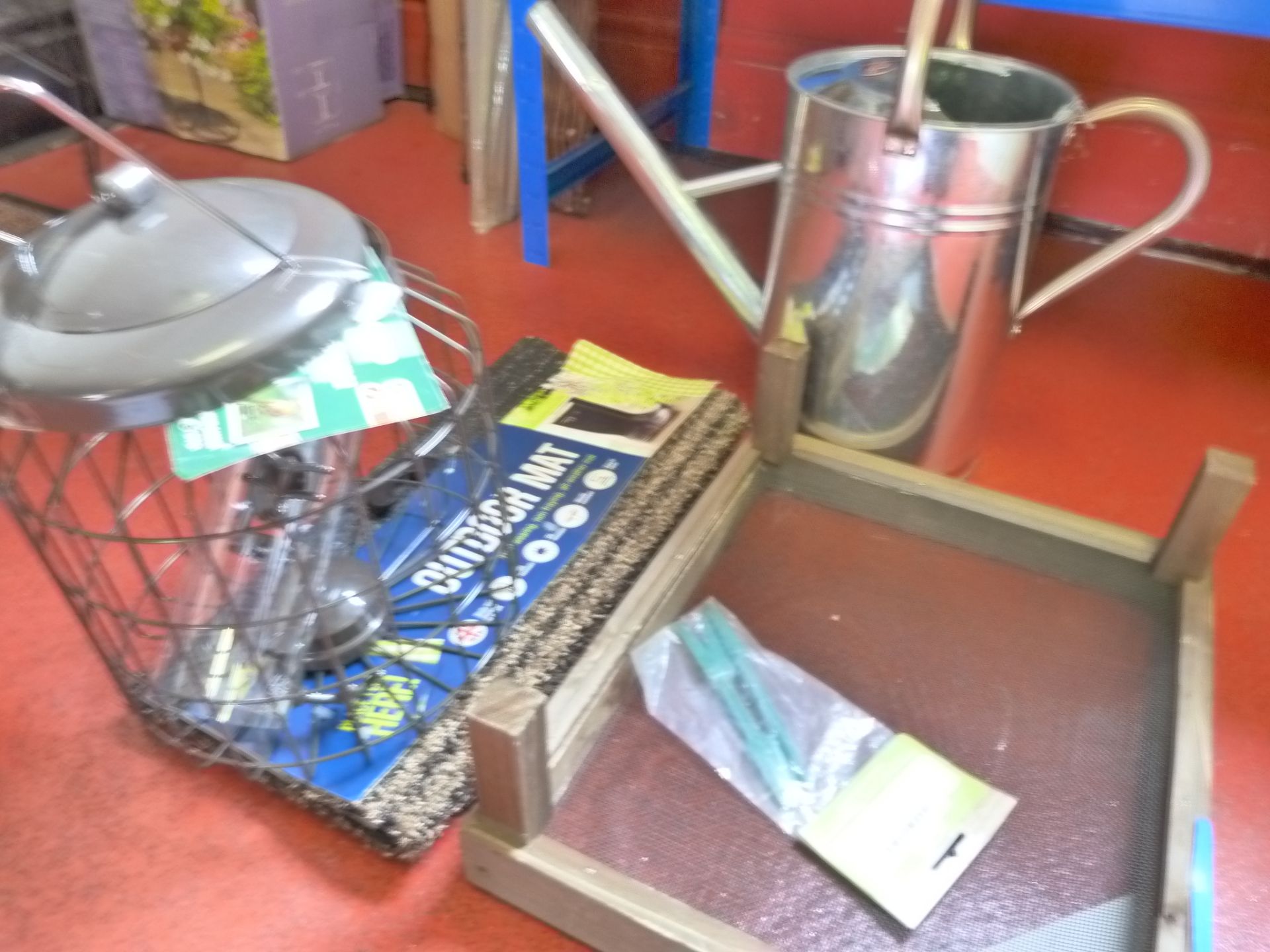 *Watering Can, Riddle, Mat and a Bird Feeder