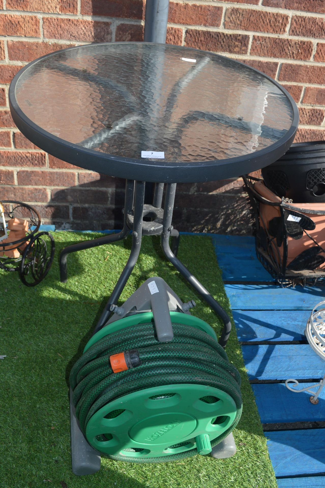 Glass Topped Garden Table and a Hose Reel