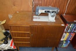 Seamstress Sewing Machine in Original Cabinet