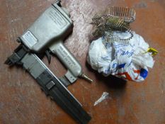 Paslode PA200-S16 Pneumatic Nail Gun and a Bag of
