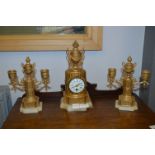 French Gilt Mantel Clock and a Pair of Candlestick Garnitures