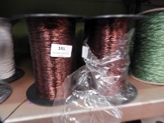 *Four Rolls of Brown Metallic Thread