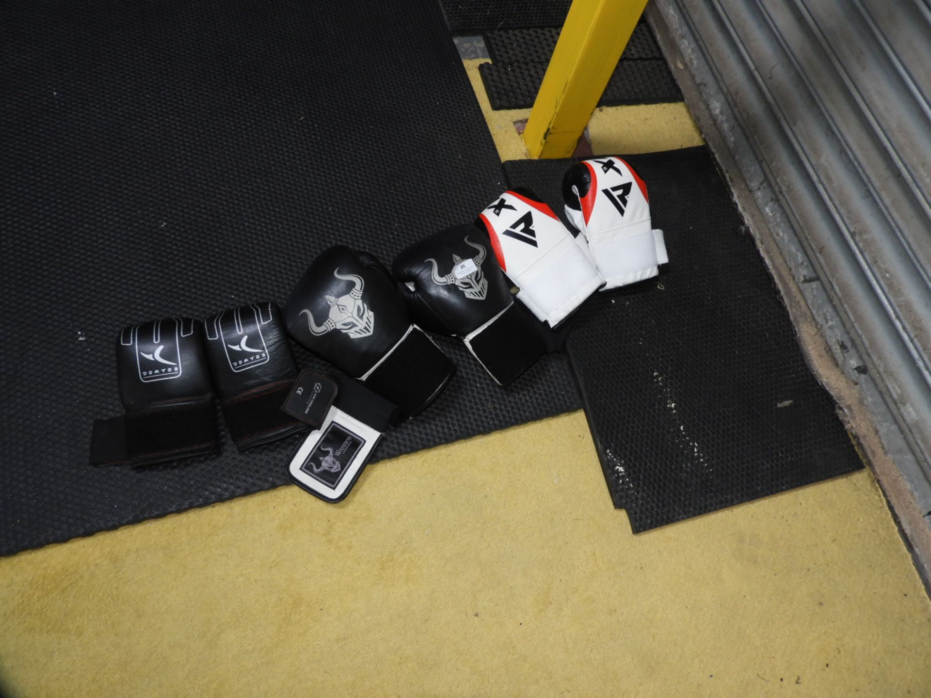 Two Sets of Sparring Gloves and One Pair of Boxing Gloves