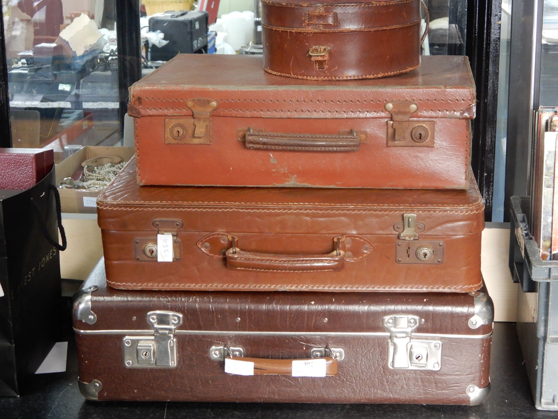 Three Vintage Suitcases and a Coal Box