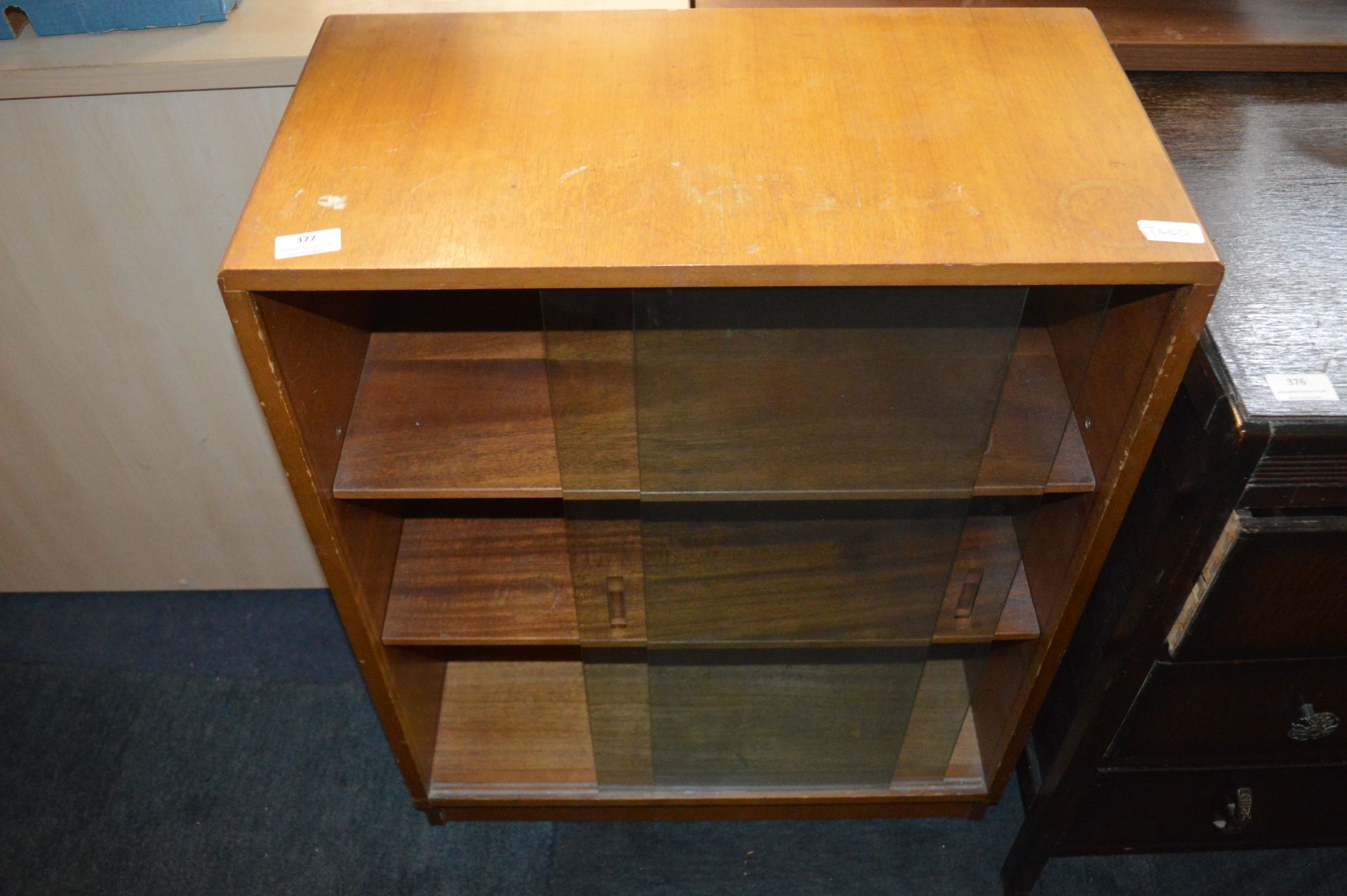 Teak Bookcase Enclosed by Sliding Glass Doors