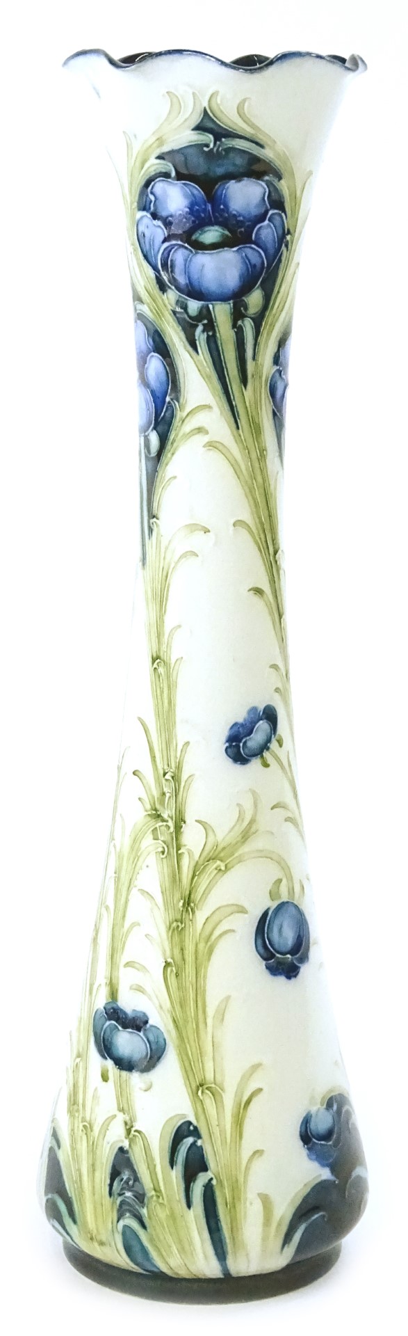 A MacIntyre & Co Moorcroft Florian ware vase, decorated with a poppy design, in blue and green, on a