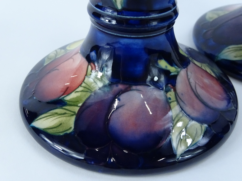 A pair of Moorcroft Wisteria pattern candlesticks, on a cobalt blue ground, impressed and hand - Image 2 of 3