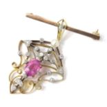 An Art Nouveau bar brooch, possibly converted from a pendant, set with central oval cut pink