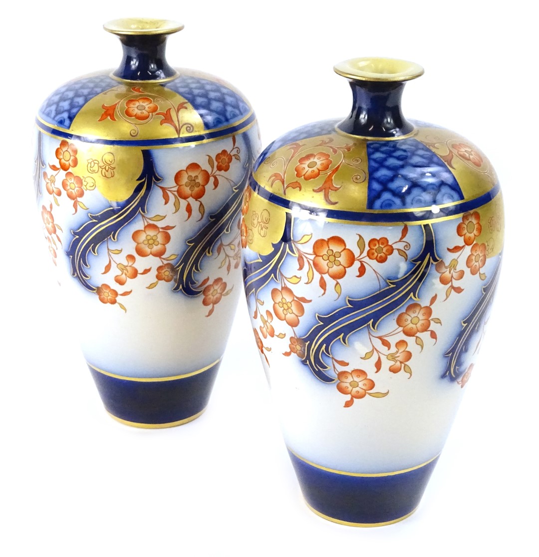 A pair of MacIntyre Aurelian ware Imari coloured vases, each decorated in Art Nouveau style with