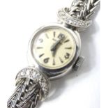 A ladies Rotary white metal and diamond wristwatch, stamped 750, 24.8g.