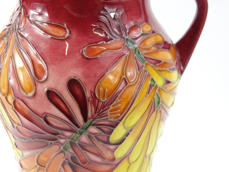 A Moorcroft two handled trial vase, decorated with brightly coloured orange, red, pink flowers, with - Image 2 of 3