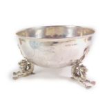 A Hanau silver marine bowl, with engraved decoration of sailing ships on a choppy sea, raised on