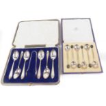 A set of six George V silver teaspoons, and a pair of sugar tongues, with stipple floral