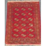 A Turkoman rug, red and blue, 125cm x 95cm.