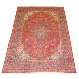 A Tabriz rug, red and blue, 338cm x 245cm.