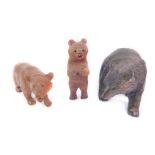 Three Black Forest type wooden carvings of bears, one modelled standing, two on all fours.