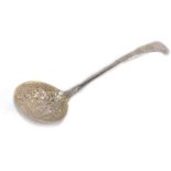 A George IV sugar sifting spoon, with embossed and engraved floral decoration, George Piercy, London