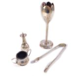 An Edward VII silver tulip bud vase, Sheffield 1907, a pair of Victorian silver sugar tongs,