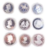 Silver proof commemorative coins, including two Queen Elizabeth II golden jubilee 50p pieces,