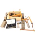 Victorian and later tools, including a coping saw, moulding planes, ebony and brass square, together